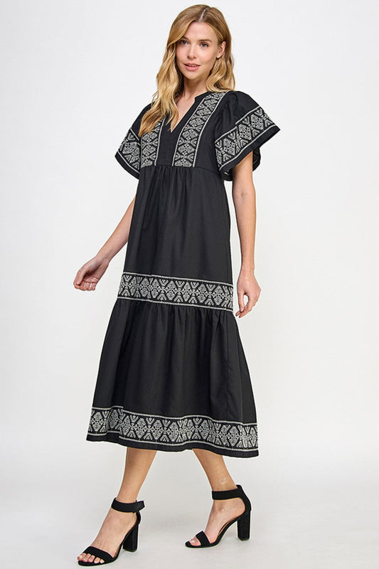 Elegant svart linkjole med broderier